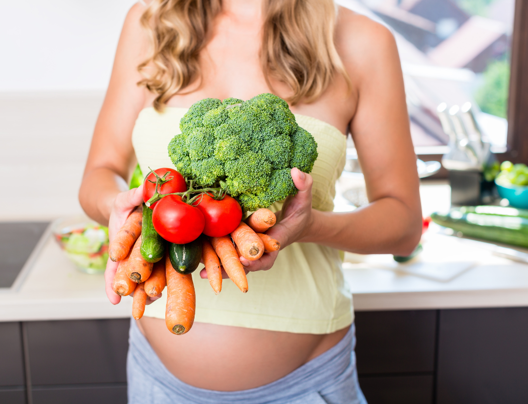 pregnant woman with healthy foods